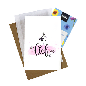 Bloemenzaden met kaart 'Ik vind je lief' verpakt in pergamijn zakje