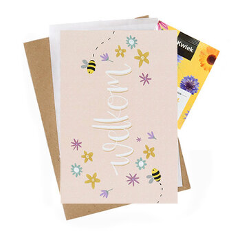 Bloemenzaden met kaart 'Welkom' verpakt in pergamijn zakje