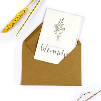 Bloemenzaden met kaart 'Jij verdient een bloemetje' verpakt in pergamijn zakje