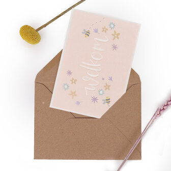 Bloemenzaden met kaart &#039;Welkom&#039; verpakt in pergamijn zakje