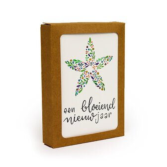 Het bedankje verpakt in een kraftpapieren uitdeeldoosje.