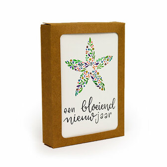 Het bedankje verpakt in een kraftpapieren uitdeeldoosje