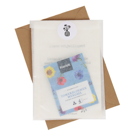 Bloemenzaden met kaart 'Bedankt zorgtopper' verpakt in pergamijn zakje