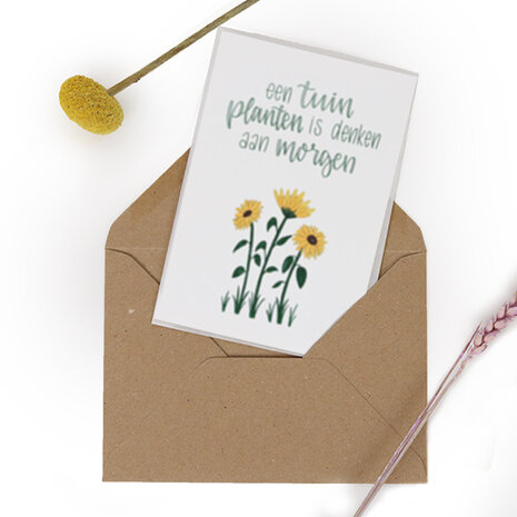 Bloemenzaden met kaart 'Een tuin planten is denken aan morgen' verpakt in pergamijn zakje