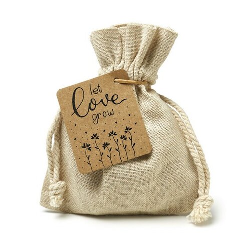 Ingepakt linnenzakje met zaden en label Let Love Grow