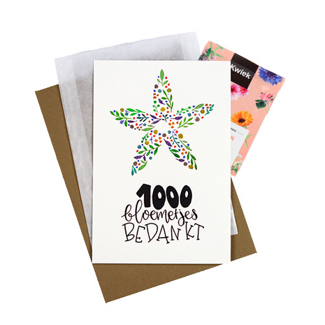 Bloemenzaden met kaart '1000 bloemetjes bedankt' verpakt in pergamijn zakje