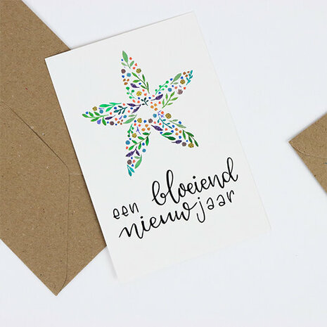 Bloemenzaden met kaart 'Een bloeiend nieuwjaar' verpakt in pergamijn zakje